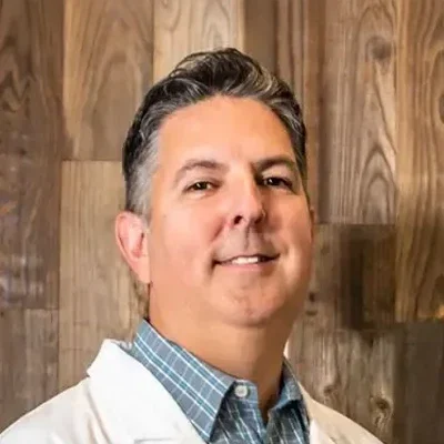 A headshot photo of dentist Dr. Erich Schmidt from El Camino Dental Arts